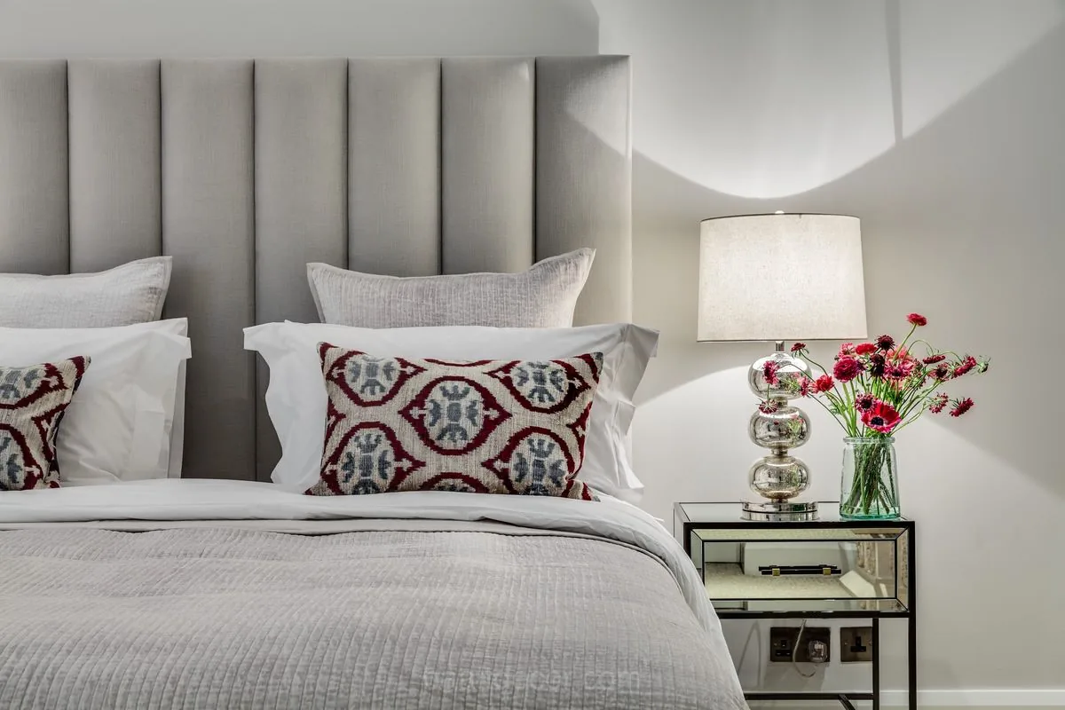 a bed with pillows and pillows on it