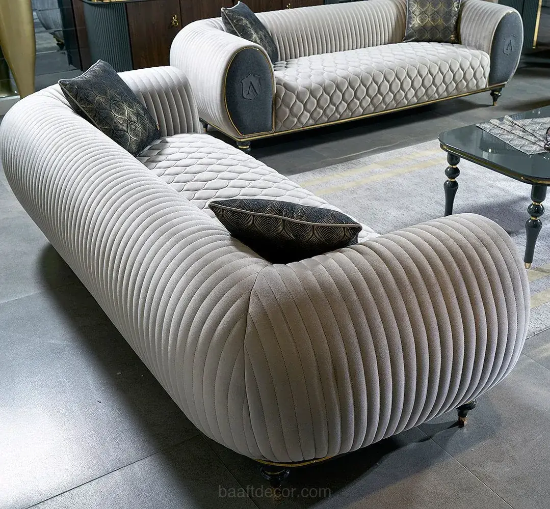 a living room with a couch and two chairs