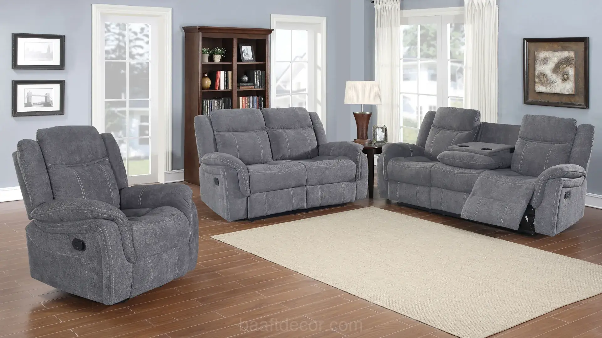 Grey fabric recliner sofas and a single recliner chair in a living room, one footrest raised