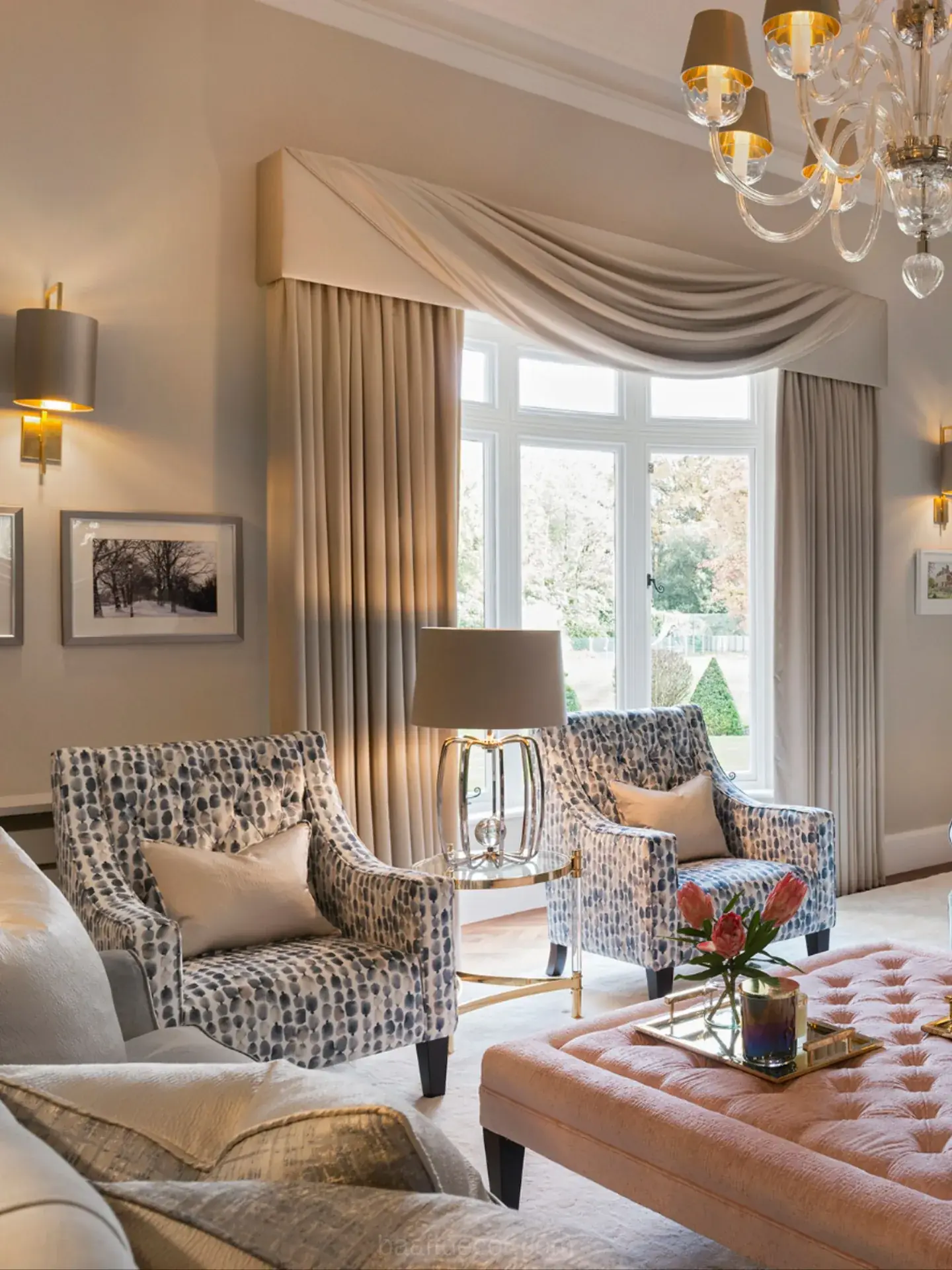 a living room with a couch, chair, coffee table, and chandel