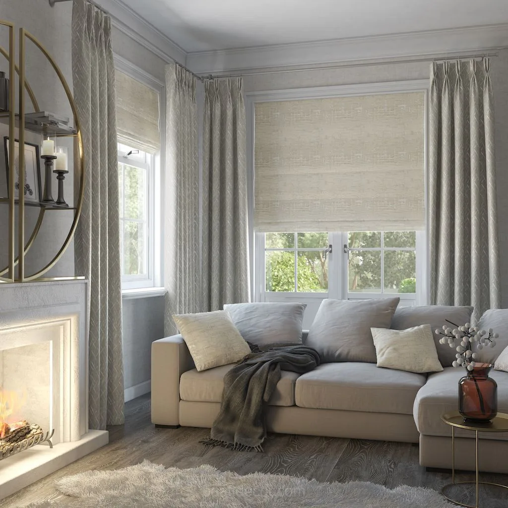 a living room with a couch, fireplace and window treatments