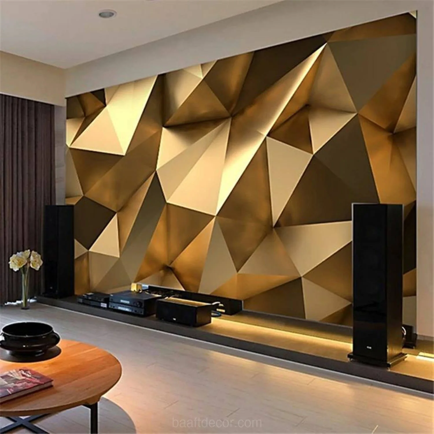 Living room media wall with a gold geometric 3D-effect finish, low TV console and LED strip lighting along the floor