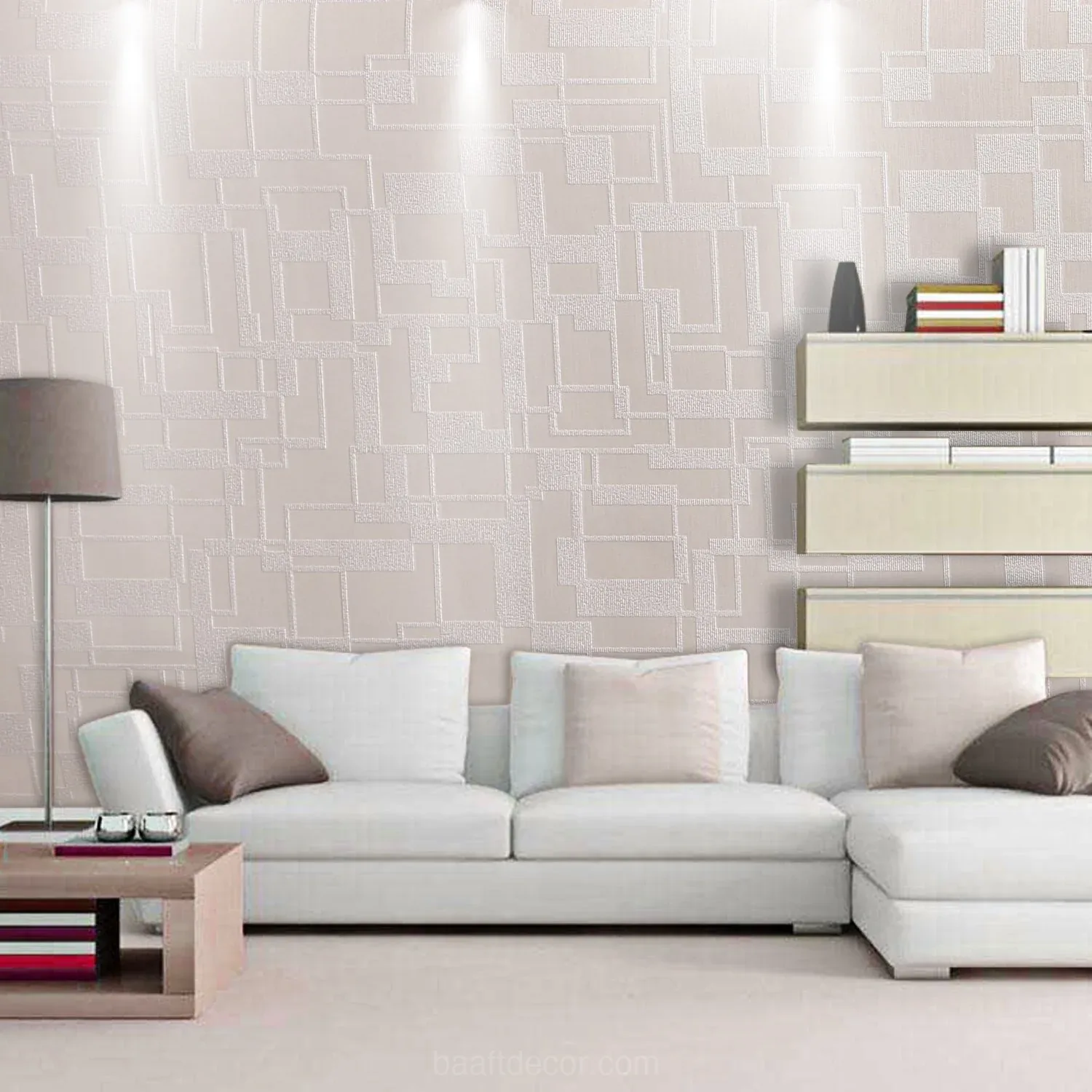 a living room with a white couch and a white wallpaper