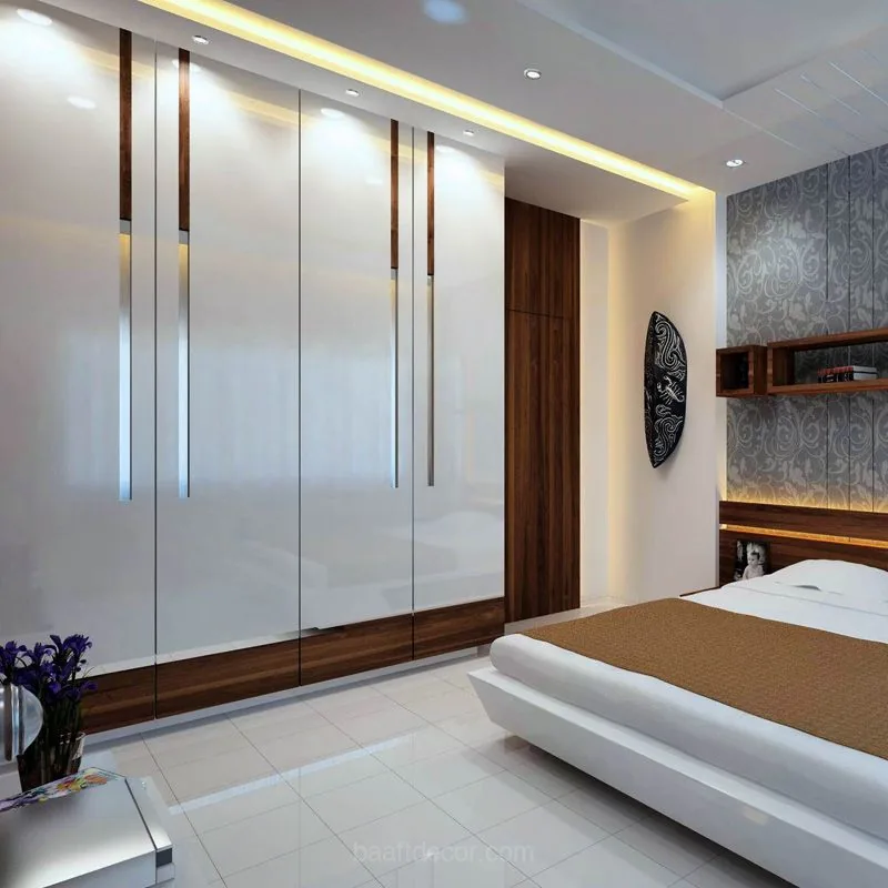 a modern bedroom with a large bed and a wall mounted wardrobe