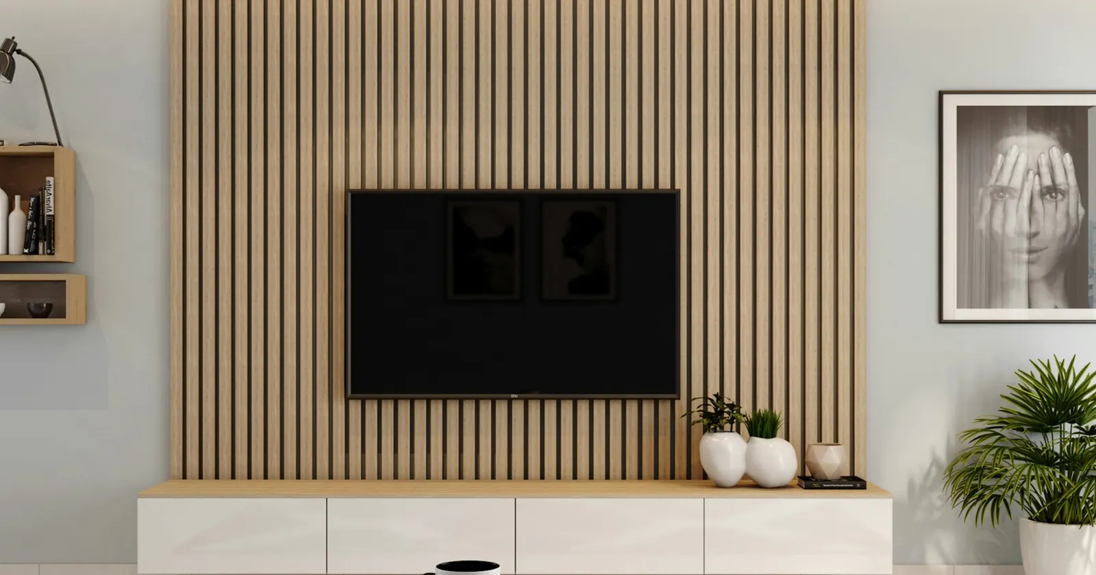 Wall-mounted TV on a full-height wooden slat panel, with a floating white unit of closed drawers below and no visible cables